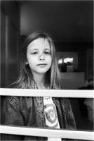 Young girl behind screen door, East Hampton, NY  © 2017 Keith Trumbo