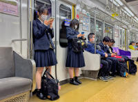 Schoolgirls on Metro, Kyoto © 2024 Keith Trumbo