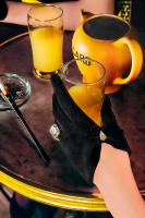 Gloved hand with an apéritif © 2019 Keith Trumbo